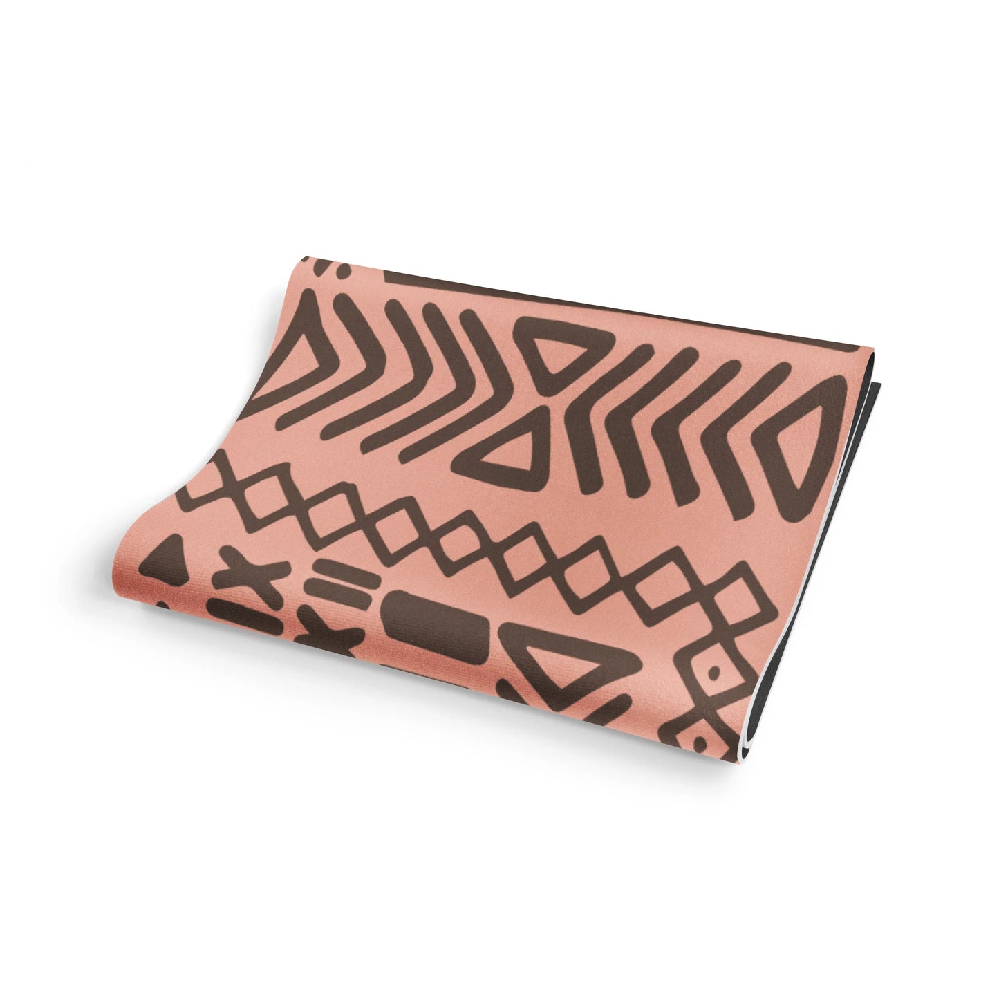 Folded pink fabric with brown geometric pattern on a white background