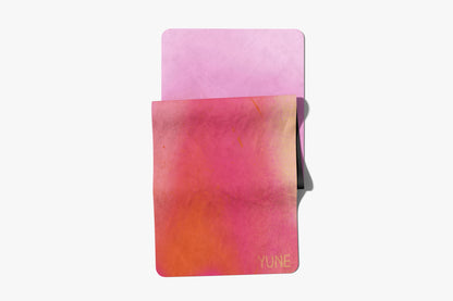 Pink and orange gradient case with 'Yune' branding on a white background