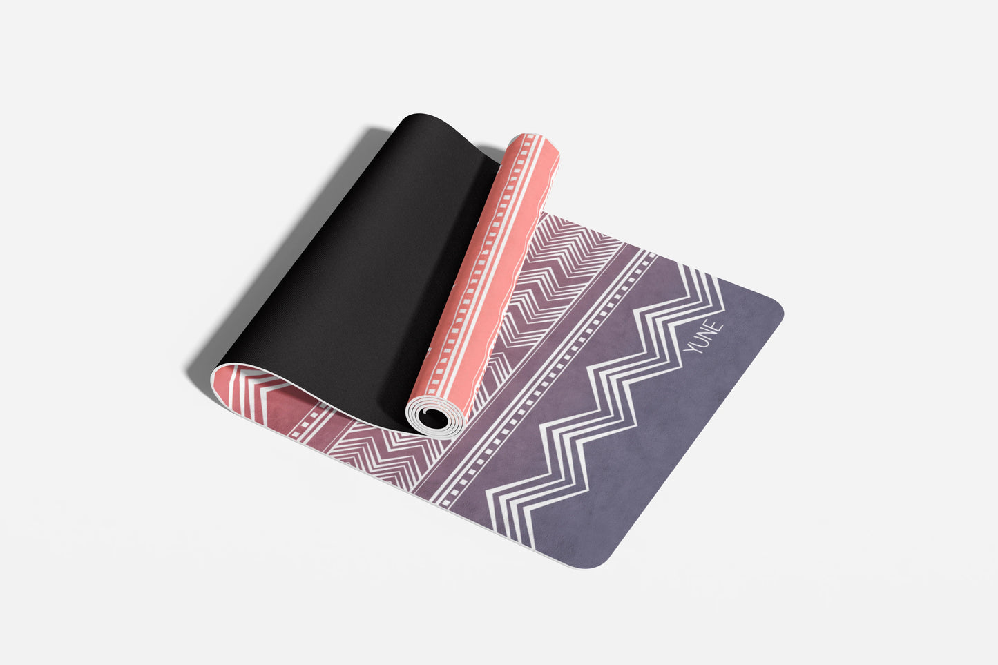 Three yoga mats of different colors and patterns on a white background