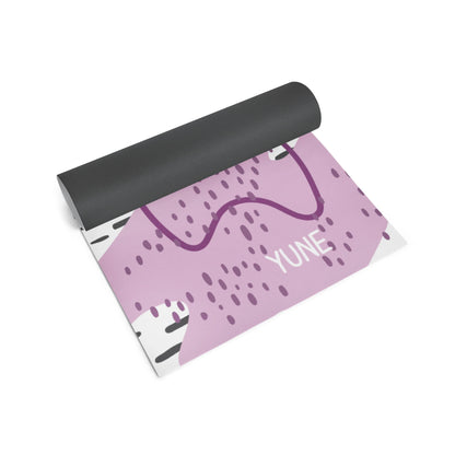Yoga mat with purple design and 'YUNE' branding on a white background