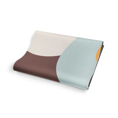 Folded fabric with three color sections on a white background