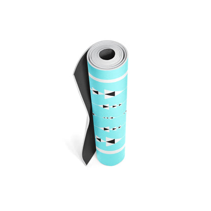 Roll of turquoise yoga mat with black and white patterns on a white background